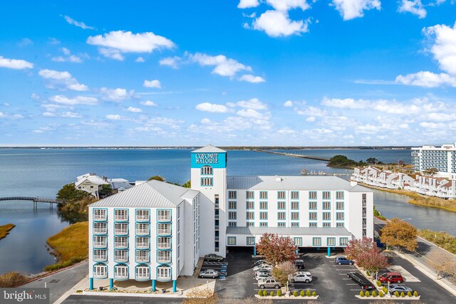 birds eye view of property featuring a water view