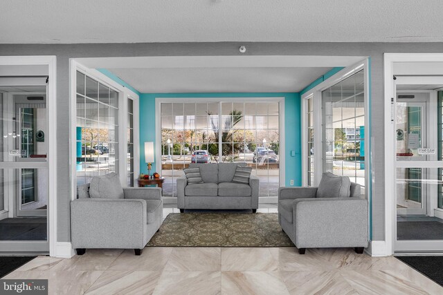 living room with a textured ceiling