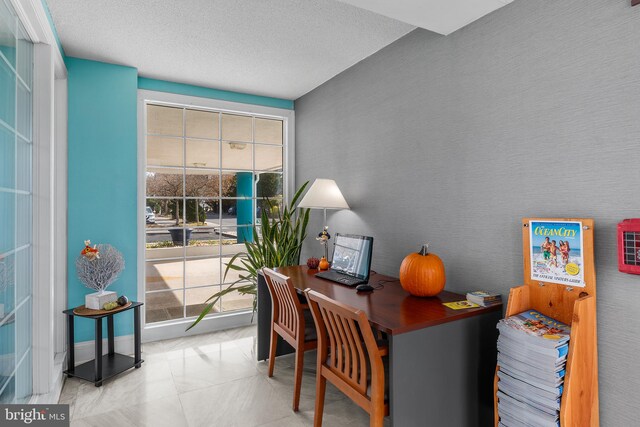 home office featuring a textured ceiling