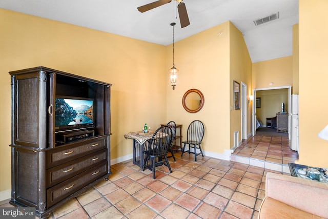 tiled dining room with high vaulted ceiling and ceiling fan