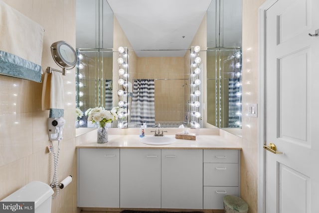 200 59th St Unit 506, Ocean City, MD 21842 - full bath featuring toilet, tile walls, vanity, and a shower with shower curtain