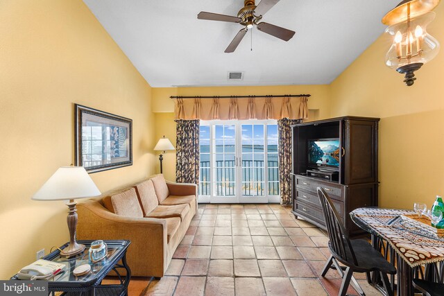 living room with high vaulted ceiling and ceiling fan