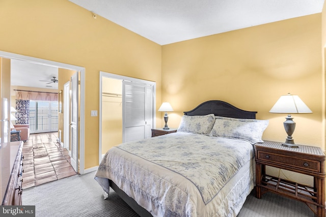 bedroom featuring a closet and light carpet