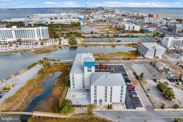 birds eye view of property with a water view