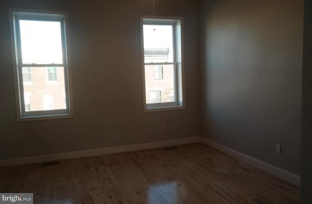 empty room featuring hardwood / wood-style floors