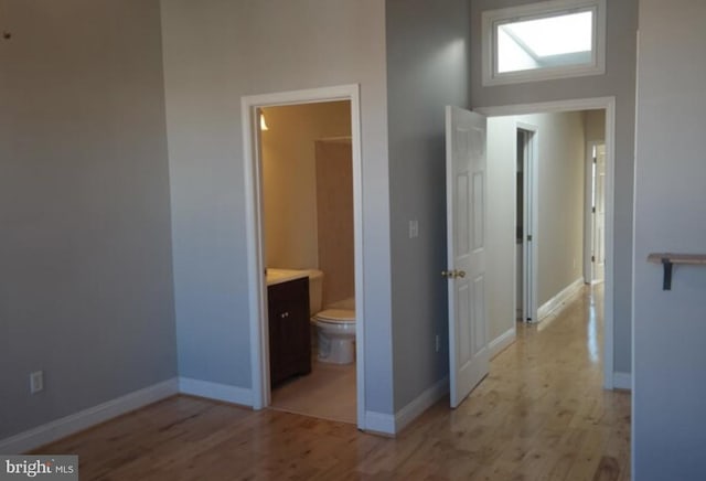 hall with light wood-type flooring