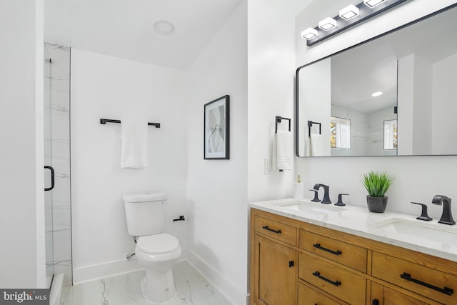 bathroom featuring a shower with shower door, vanity, and toilet