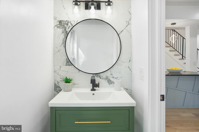 bathroom with vanity and hardwood / wood-style flooring