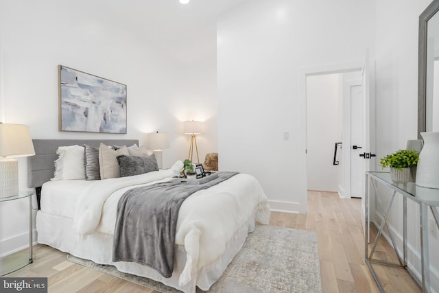 bedroom with light hardwood / wood-style floors