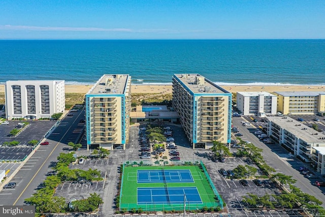 aerial view with a water view and a view of the beach