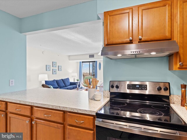 kitchen featuring stainless steel electric range