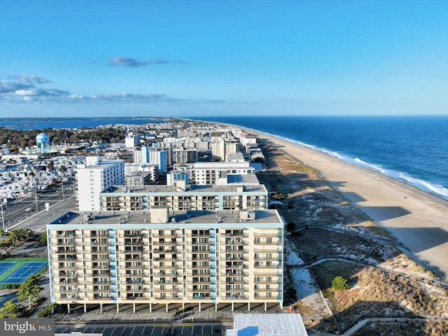 birds eye view of property with a beach view and a water view