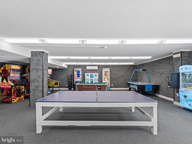 game room with a textured ceiling, carpet floors, and a wall mounted air conditioner