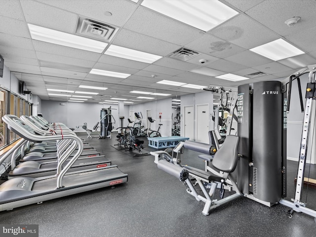 workout area featuring a drop ceiling