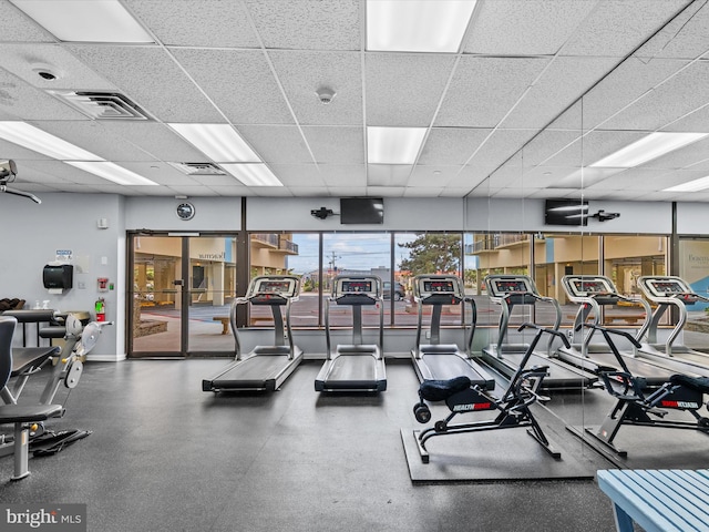 workout area with a paneled ceiling