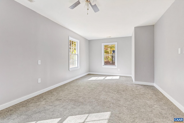 empty room featuring carpet and ceiling fan