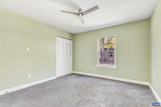 unfurnished bedroom featuring a closet, ceiling fan, and carpet