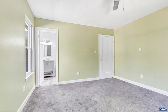 empty room with carpet and ceiling fan