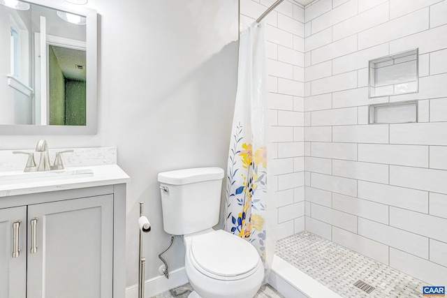 bathroom featuring vanity, toilet, and a shower with shower curtain