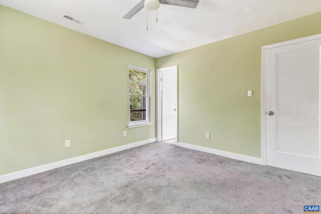 unfurnished room featuring ceiling fan and carpet floors