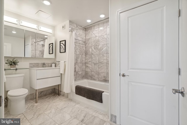 full bathroom with shower / tub combo with curtain, vanity, and toilet