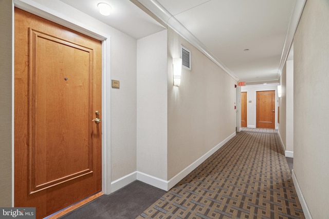 hallway featuring crown molding