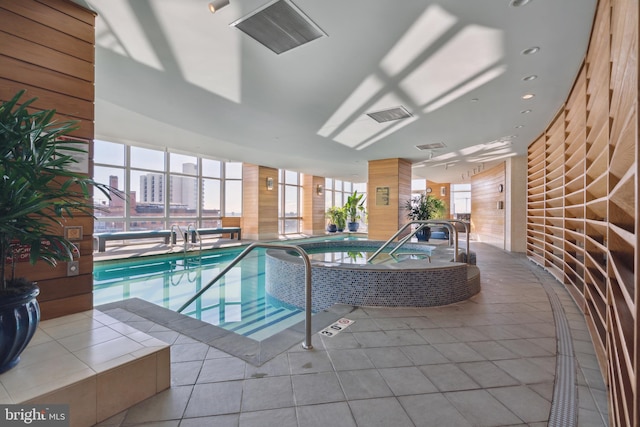 view of swimming pool with an indoor in ground hot tub