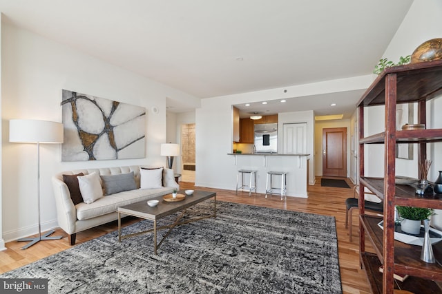 living room with light hardwood / wood-style floors