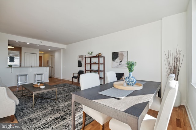 dining area with hardwood / wood-style floors