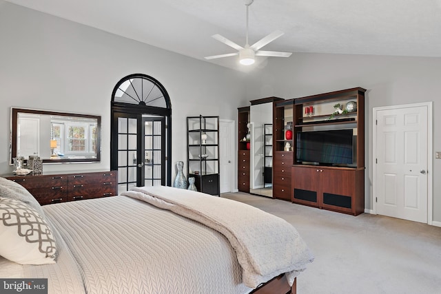 bedroom with light carpet, french doors, high vaulted ceiling, and ceiling fan