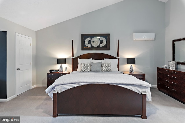 carpeted bedroom with a wall unit AC and vaulted ceiling