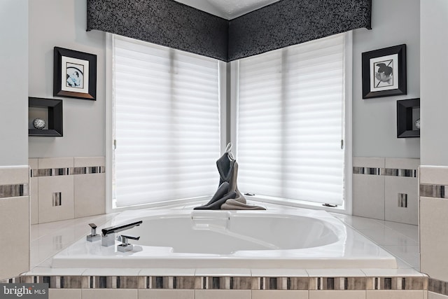 bathroom featuring a relaxing tiled tub