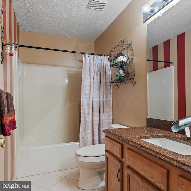 full bathroom with shower / tub combo, tile patterned floors, a textured ceiling, vanity, and toilet