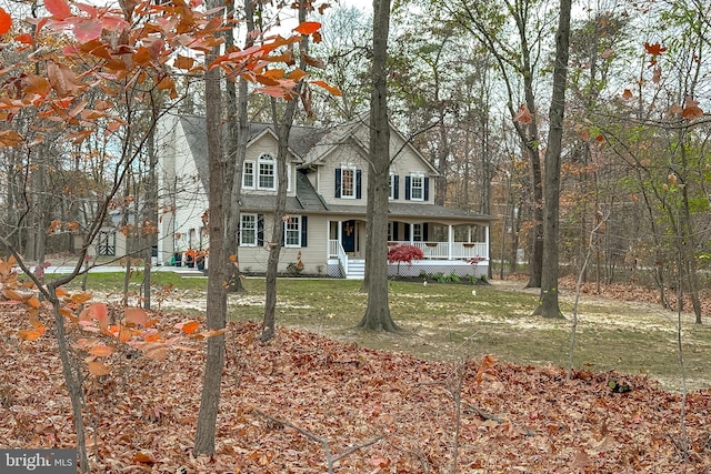 view of front of home featuring covered porch and a front yard