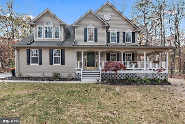 view of front of home featuring covered porch and a front lawn