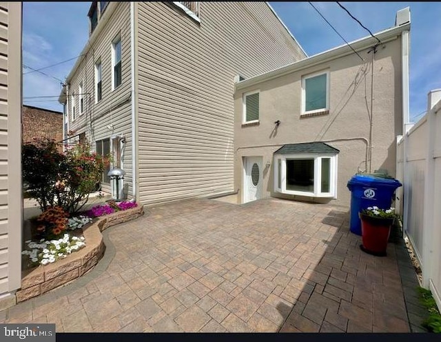 back of property with a patio area