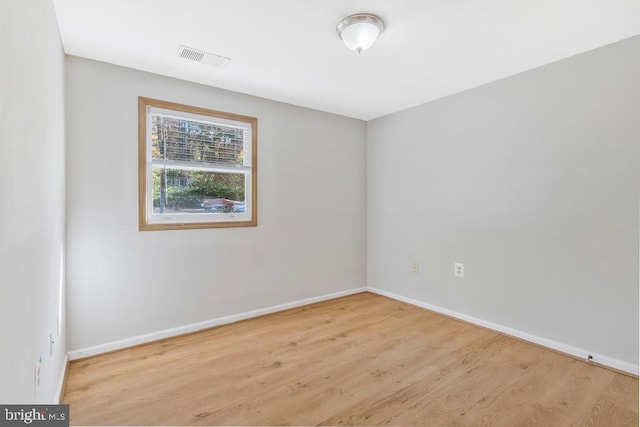 unfurnished room featuring light wood-type flooring