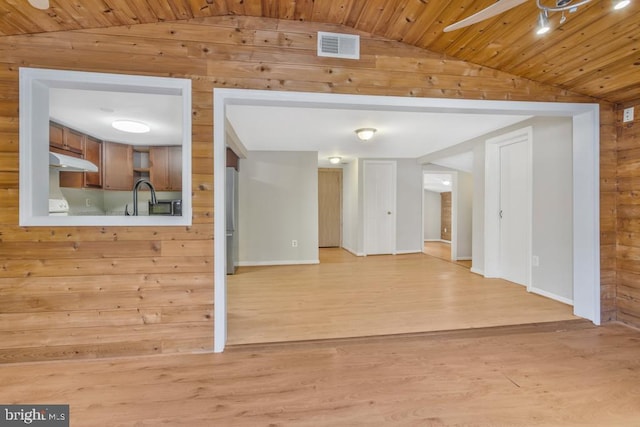 unfurnished living room with wooden ceiling, ceiling fan, light wood-type flooring, and lofted ceiling