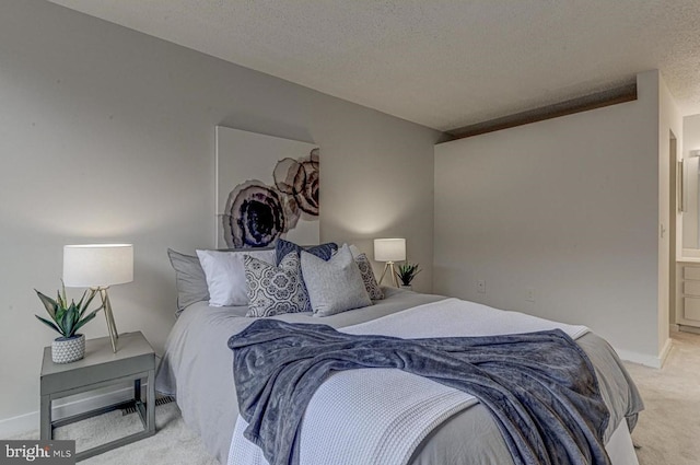 carpeted bedroom with a textured ceiling