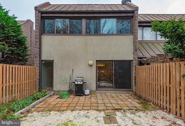 rear view of house featuring a patio