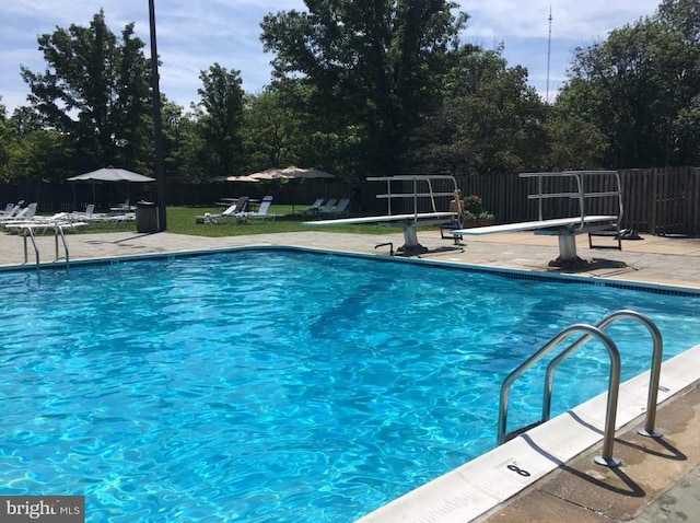 view of swimming pool with a patio