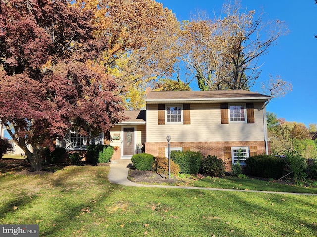 split level home with a front yard