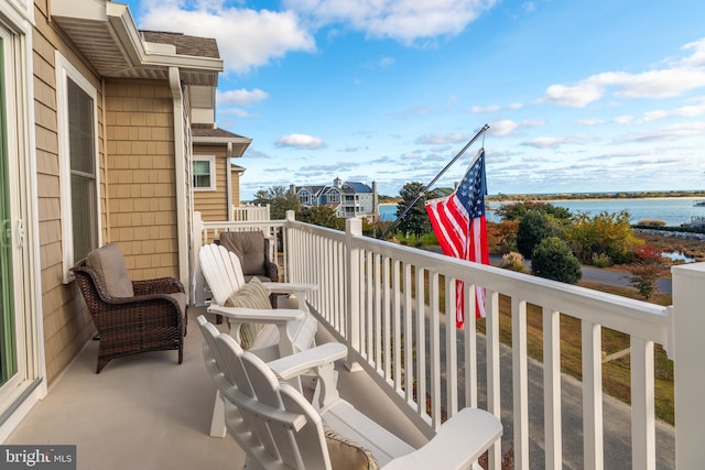 balcony featuring a water view