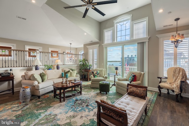 12920 Carmel Ave Unit 10, Ocean City, MD 21842 - living room featuring wood finished floors, high vaulted ceiling, ceiling fan, baseboards, and a chandelier