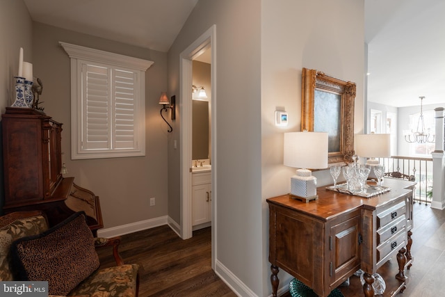 12920 Carmel Ave Unit 10, Ocean City, MD 21842 - hallway with wood finished floors, a chandelier, baseboards, and lofted ceiling