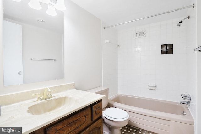 full bathroom with vanity, toilet, and tiled shower / bath combo