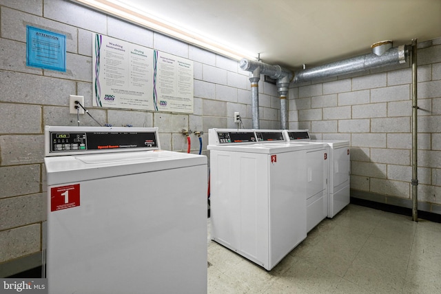 washroom with washing machine and dryer