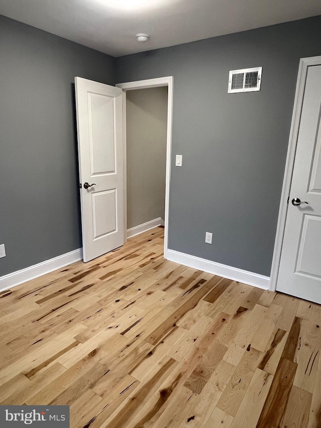 unfurnished bedroom with light hardwood / wood-style flooring