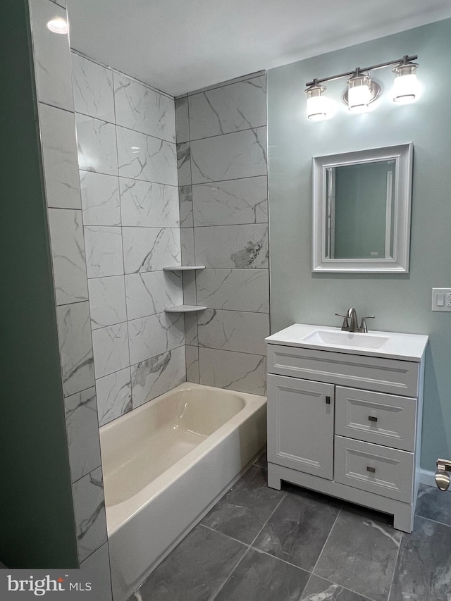 bathroom with vanity and tiled shower / bath combo