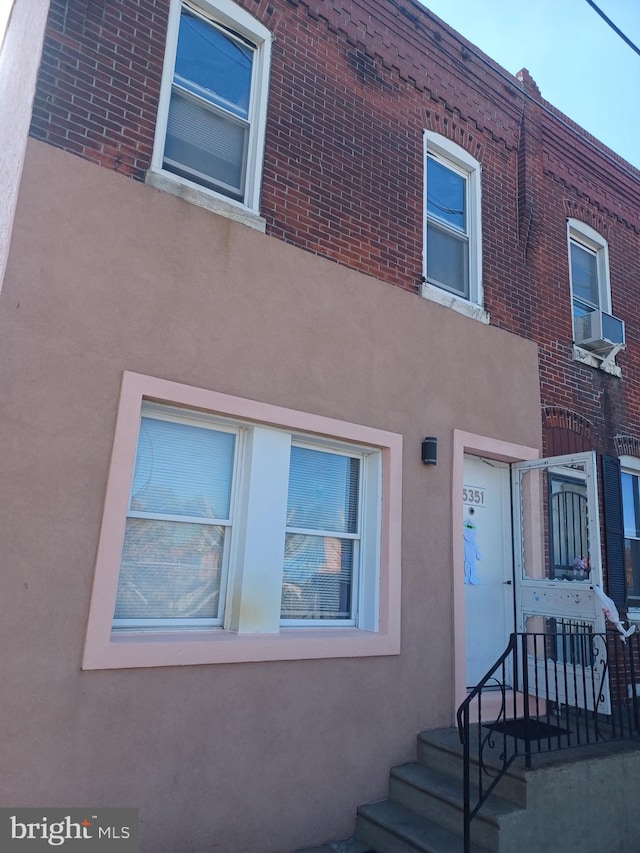 view of home's exterior with cooling unit